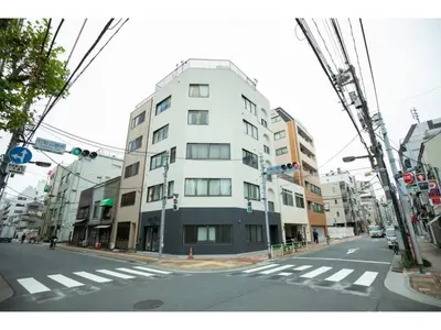 a tall white building on a city street at Tora Hotel Taito - Vacation STAY 53059v in Tokyo