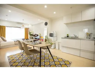 a kitchen and living room with a table and chairs at Tora Hotel Taito - Vacation STAY 53059v in Tokyo