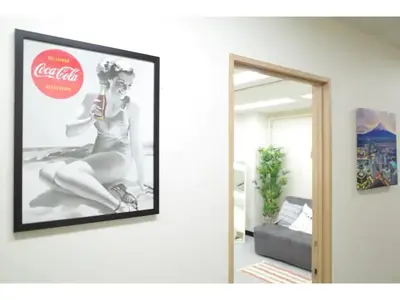 a picture of a woman on a wall in a living room at Tora Hotel Taito - Vacation STAY 53048v in Tokyo