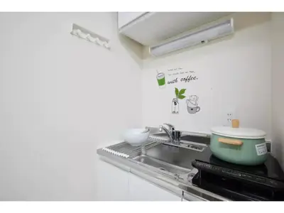 a kitchen with a sink and a pot on the stove at Tora Hotel Taito - Vacation STAY 53053v in Tokyo