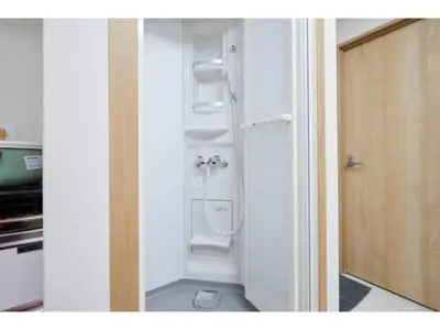 a bathroom with a toilet in the corner of a room at Tora Hotel Taito - Vacation STAY 53053v in Tokyo