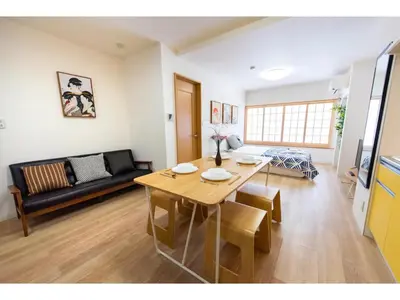 a living room with a table and a couch at Tora Hotel Taito - Vacation STAY 53094v in Tokyo