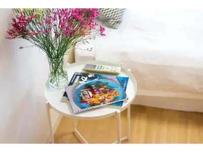 a white table with a vase of flowers and a table with a vase at Tora Hotel Taito - Vacation STAY 53094v in Tokyo