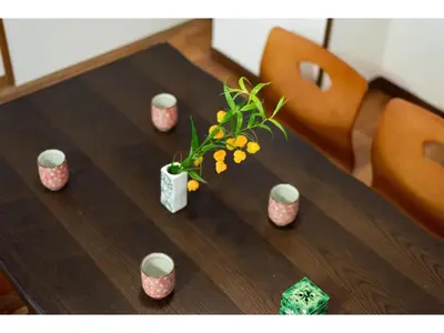 a wooden table with a vase of flowers on it at Tora Hotel Taito - Vacation STAY 53094v in Tokyo