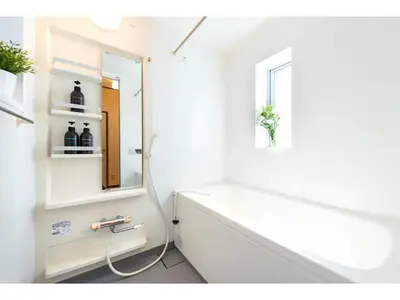 a bathroom with a bath tub and a mirror at Tora Hotel Taito - Vacation STAY 53094v in Tokyo
