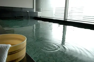 a cup of coffee sitting on a table in a room at Hotel Le Port Kojimachi in Tokyo