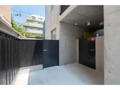 a hallway with two black doors in a building at bmj Hyakunincho - Vacation STAY 46879v in Tokyo