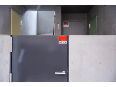 a metal door with a sign on it in a room at bmj Hyakunincho - Vacation STAY 46879v in Tokyo