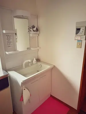a bathroom with a sink and a mirror at Uhome Ueno Hotel in Tokyo