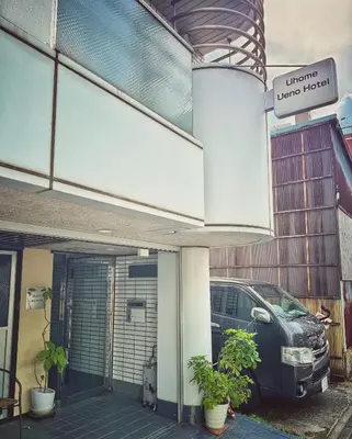 a car parked in front of a garage at Uhome Ueno Hotel in Tokyo