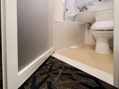 a bathroom with a toilet and a sink at APA Hotel Akihabara Ekihigashi in Tokyo