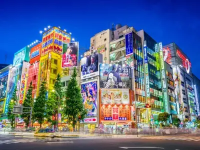 a group of buildings with colorful signs on them at APA Hotel Akihabara Ekihigashi in Tokyo