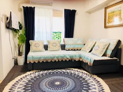 a living room with a couch and a window at Liberte Nishigotanda - Vacation STAY 11658 in Tokyo