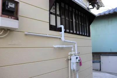 a security camera on the side of a building at \u30ea\u30c6\u30c3\u30af\u30b9\u6d66\u5b89 in Tokyo