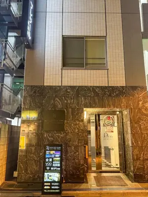a building with a door in front of it at Hotel Plaisir Akihabara in Tokyo