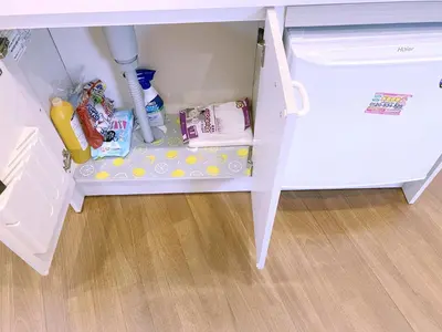 a small white refrigerator with its door open at SKYE HOME MINPAKU - Vacation STAY 11856 in Tokyo