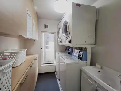 a small kitchen with white appliances and a window at YUYU-Wa-3 --Self Check-in -- Room Number & Password is in the following email in Tokyo