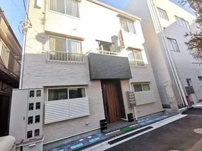a white building with a door and a balcony at YUYU-Yo-3 --Self Check-in -- Room Number & Password is in the following email in Tokyo