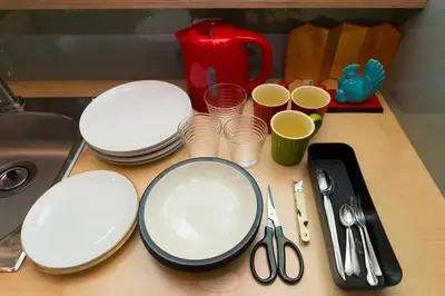 a counter top with plates and cups and scissors at \u8461\u8404\u306e\u9577\u5c4b in Tokyo