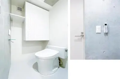 a white bathroom with a toilet and a shower at japan house nishishinjuku in Tokyo