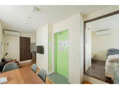 a conference room with a table and a mirror at bmj Hyakunincho - Vacation STAY 68270v in Tokyo