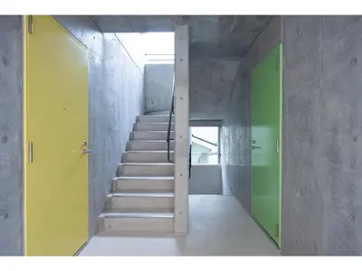 a staircase in a room with green and yellow doors at bmj Hyakunincho - Vacation STAY 68270v in Tokyo