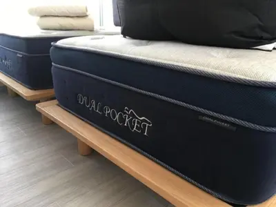 two blue mattresses sitting on a wooden table at bmj Shinjuku Okubo - Vacation STAY 68278v in Tokyo