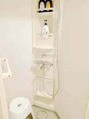 a shower in a bathroom with a toilet at Hotel Tiffany in Tokyo