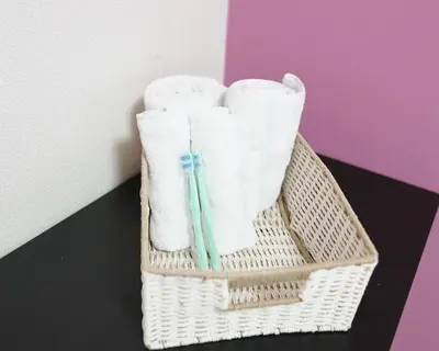 a basket with towels and a toothbrush in it at OHANA TOKYO HOUSE - Vacation STAY 71468v in Tokyo