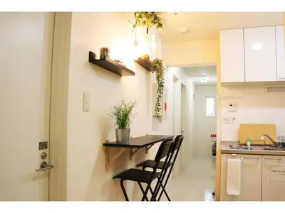 a kitchen with a table and chairs in a room at OHANA TOKYO HOUSE - Vacation STAY 71468v in Tokyo