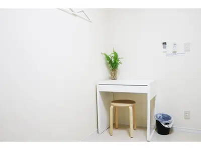 a white desk with a stool and a plant on it at OHANA TOKYO HOUSE - Vacation STAY 71658v in Tokyo