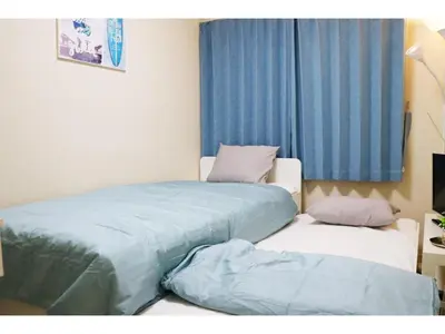 two beds sitting next to each other in a room at OHANA TOKYO HOUSE - Vacation STAY 73207v in Tokyo