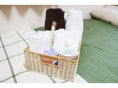 a basket filled with toilet paper and toiletries at OHANA TOKYO HOUSE - Vacation STAY 73215v in Tokyo