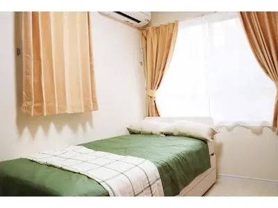 a small bedroom with a bed and a window at OHANA TOKYO HOUSE - Vacation STAY 73215v in Tokyo
