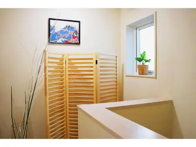 a room with a wooden partition and a window at OHANA TOKYO HOUSE - Vacation STAY 73216v in Tokyo