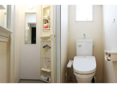 a small bathroom with a toilet and a window at OHANA TOKYO HOUSE - Vacation STAY 73655v in Tokyo