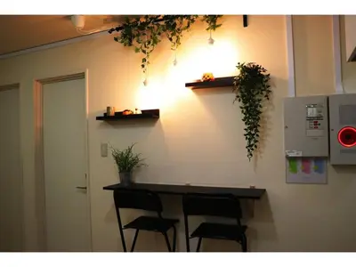 a room with a counter with chairs and a light at OHANA TOKYO HOUSE - Vacation STAY 73208v in Tokyo