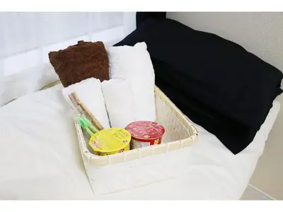 a tray with towels and other items on a bed at OHANA TOKYO HOUSE - Vacation STAY 71661v in Tokyo