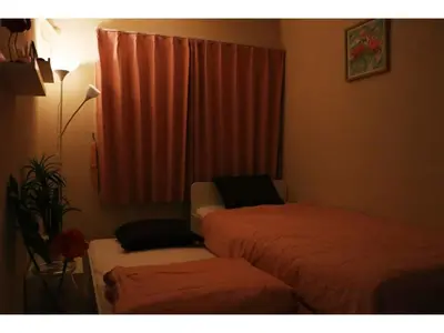 a small room with two beds and a window at OHANA TOKYO HOUSE - Vacation STAY 71661v in Tokyo