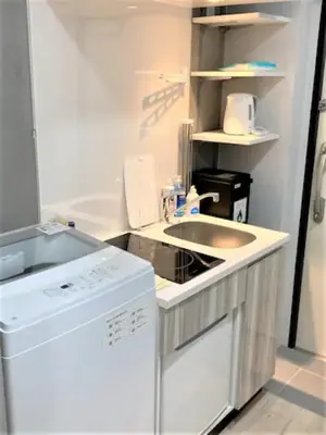 a white kitchen with a sink and a dishwasher at Marvelous Ryogoku - Vacation STAY 73442v in Tokyo