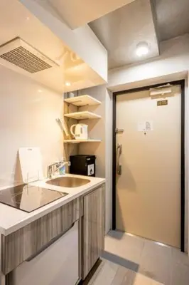 a kitchen with a sink and a door leading into a room at Marvelous Ryogoku - Vacation STAY 73442v in Tokyo
