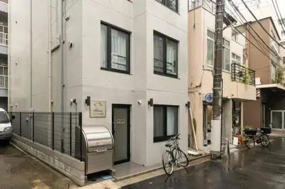 a white building with a bike parked on a street at Marvelous Ryogoku - Vacation STAY 73442v in Tokyo