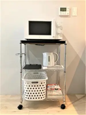 a television and a microwave on a cart at Marvelous Ryogoku - Vacation STAY 74210v in Tokyo