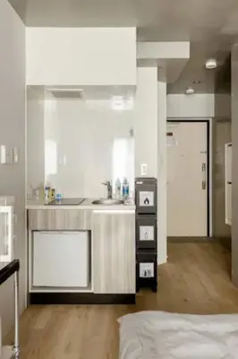 a white kitchen with a sink and a counter at Marvelous Ryogoku - Vacation STAY 74210v in Tokyo