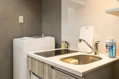 a kitchen with a sink and a washing machine at Marvelous Ryogoku - Vacation STAY 74211v in Tokyo