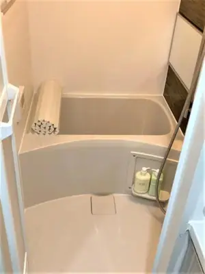 a bathtub in a small bathroom with a towel at Marvelous Ryogoku - Vacation STAY 74212v in Tokyo