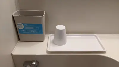 a counter with a roll of toilet paper and a container at Toyoko Inn Tokyo Tozai-sen Nishi-kasai in Tokyo
