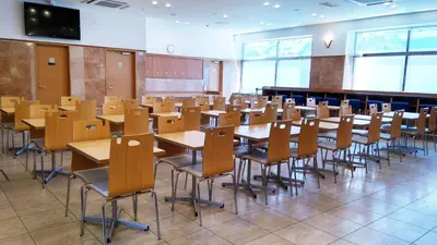 an empty classroom with tables and chairs in it at Toyoko Inn Tokyo Shinjuku Kabukicho in Tokyo