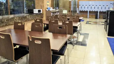 a row of tables and chairs in a cafeteria at Toyoko Inn Tokyo Korakuen Bunkyokuyakusho Mae in Tokyo