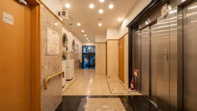 a hallway in a building with a hallwayiterator at Toyoko Inn Tokyo Asakusa Kuramae No 1 in Tokyo